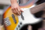 Beloved Musician Dead at 50 Following Stroke Bass Guitar Player Performing