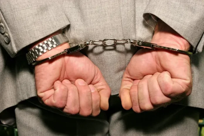 Former President Given 25 Years In Jail (handcuffs dreamstime_s_1688192)