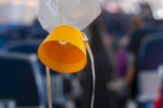 Passengers Terrified as Ceiling Caves In Midflight Passengers Terrified as Ceiling Caves In Midflight (o2-mask-dreamstime_s_273243640)